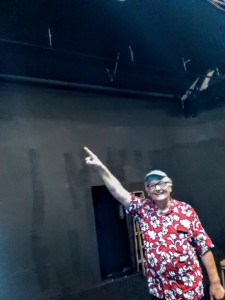 Ray Tatar inspects renovations in the California Stage Theater